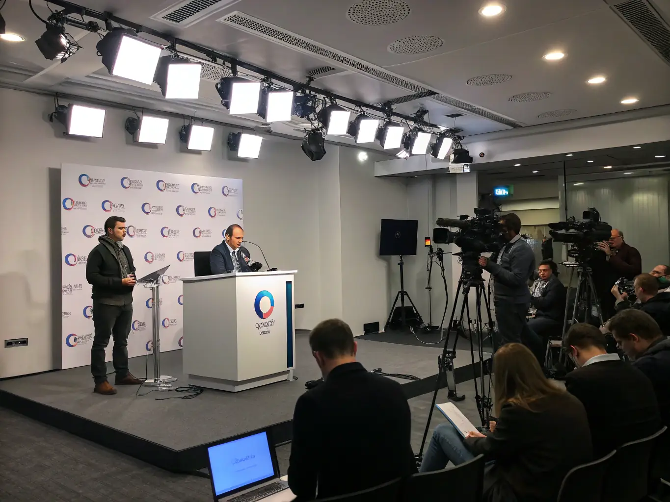 A public relations team is coordinating a press conference, managing media relations and ensuring key messages are delivered effectively.